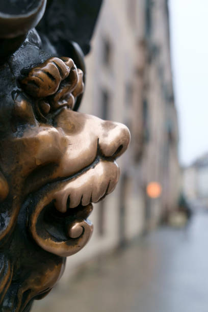Lions head on an old bronze plate in Munich, Germany