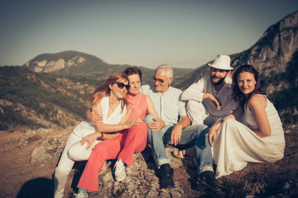 istock Happy family on mountain rock 872207618