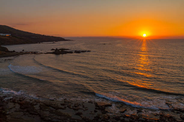 istock Beautiful sunset at a rocky beach in Pomos, Cyprus 872214794
