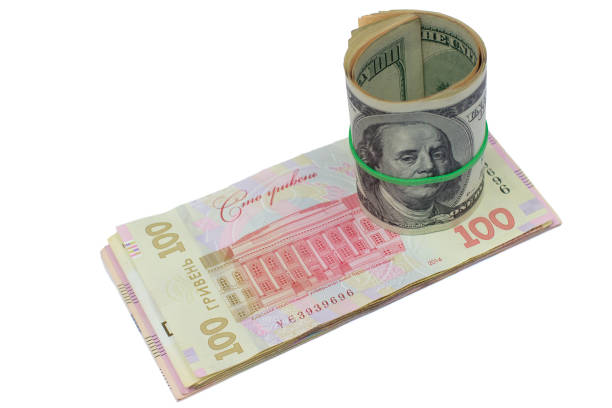 istock dollars and Ukrainian hryvnia 872221632
