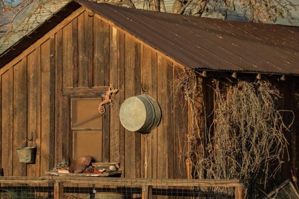 Miner's Cabin An old rustic miner's cabin with a washtub on the wall. miners cabin stock pictures, royalty-free photos & images