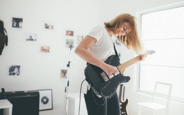 istock Charming girl guitarist 872222612