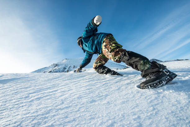 istock climber with an ice ax climb on the snowy mountain 872226180