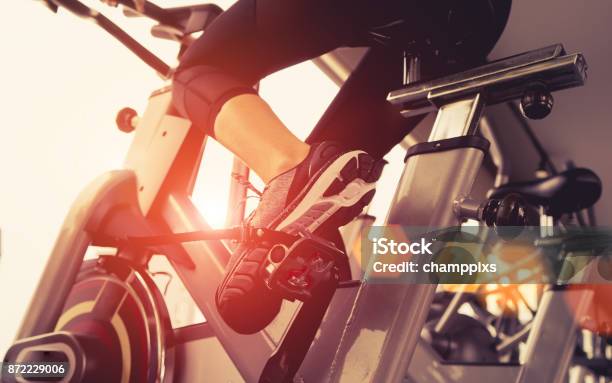 Exercise Bike Cardio Workout At Fitness Gym Of Woman Taking Weight Loss With Machine Aerobic For Slim And Firm Healthy In The Morning Stock Photo - Download Image Now