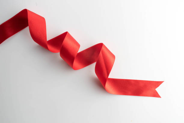 istock red bow ribbon satin texture isolated on white background 872231884