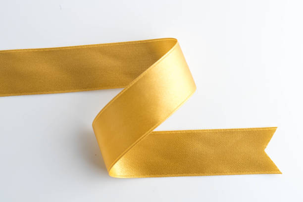istock gold bow ribbon satin texture isolated on white background 872232144