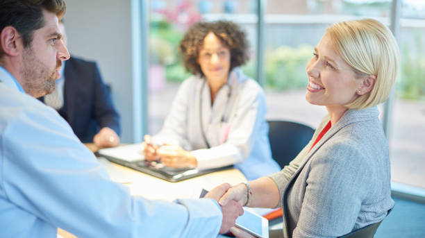 istock hospital team greeting business 872238262