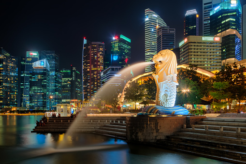 Singapore, Singapore - October 15, 2017: Singapore city downtown and Merlion statue at night