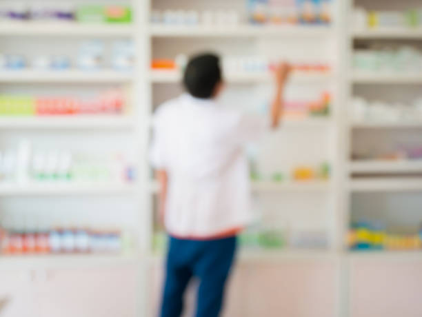 istock blur image of pharmacist working in the pharmacy 872238802