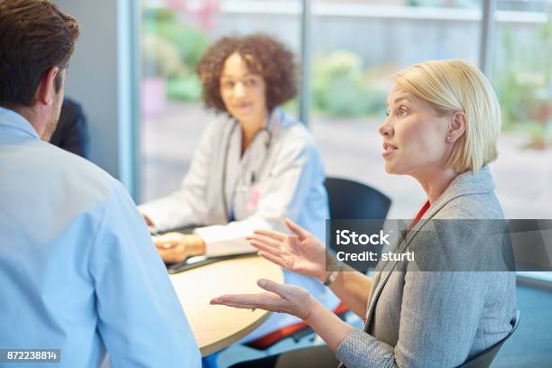 Sales Talk To Doctors Stock Photo - Download Image Now - Hospital, Meeting, Healthcare And Medicine