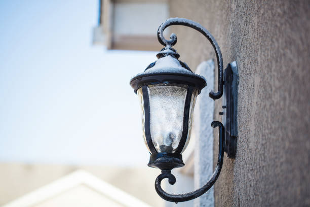 istock Outdoor decorative light covered in snow and ice 872243074