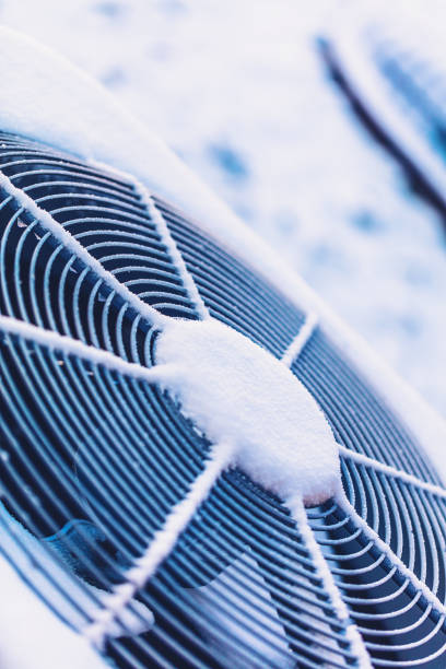 istock Air conditioning unit covered in snow 872243246