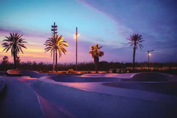 Photo of a skate park in the dusk.