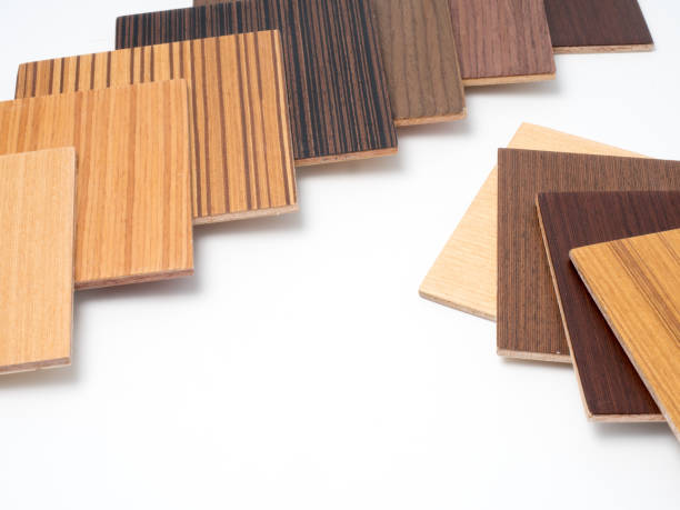 istock Samples of veneer wood on white background. interior design select material for idea.Hand holding veneer wood. 872250468