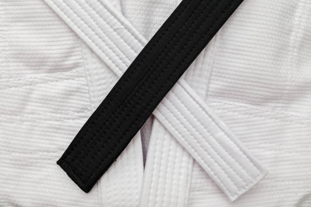 istock White kimono with white and black belts 872251440