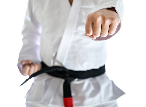 istock Black belt karate fighter punching 872253626