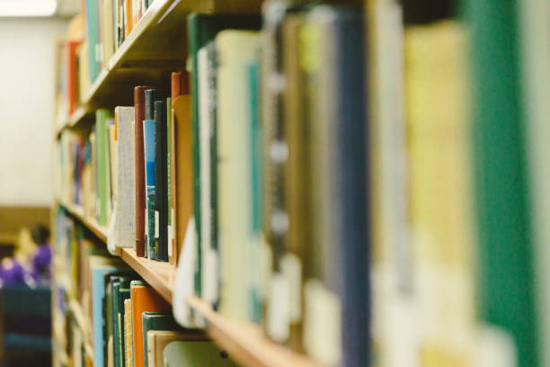istock Close up of books on library shelf 872254072