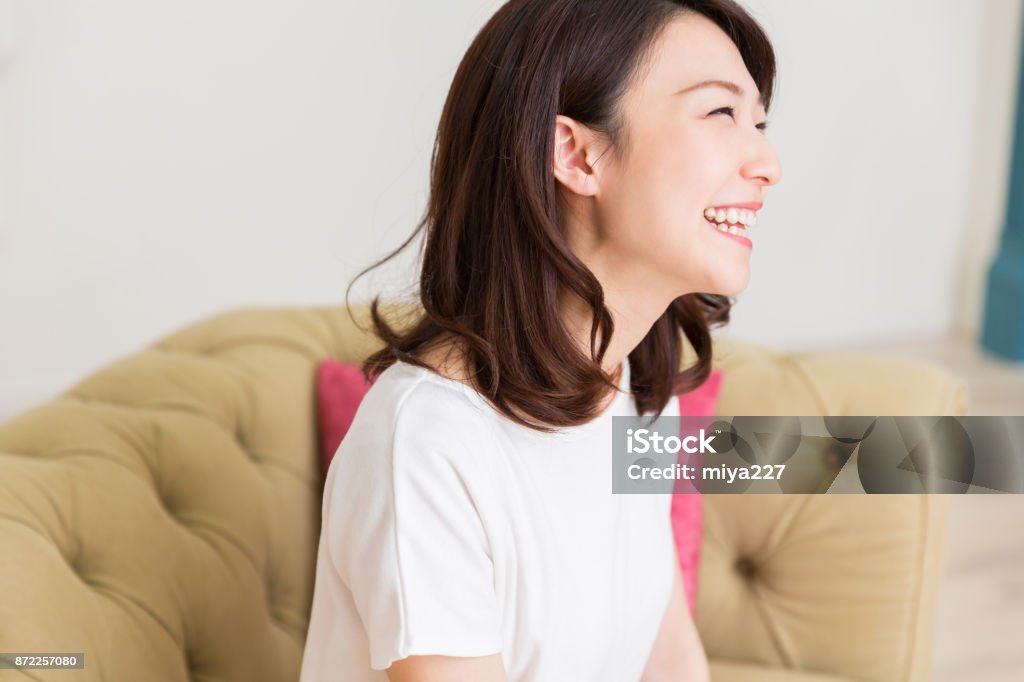 woman relaxing young attractive asian woman relaxing Japanese Ethnicity Stock Photo