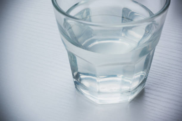 istock Close-up on a Glass of Water on Table 872258040