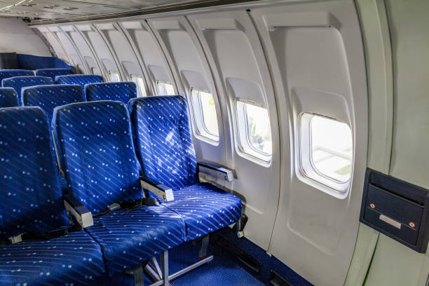 istock Empty seat rows in commercial aircraft cabin 872260776