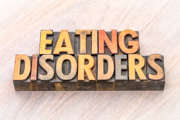 istock eating disorders word abstract in wood type 872260784