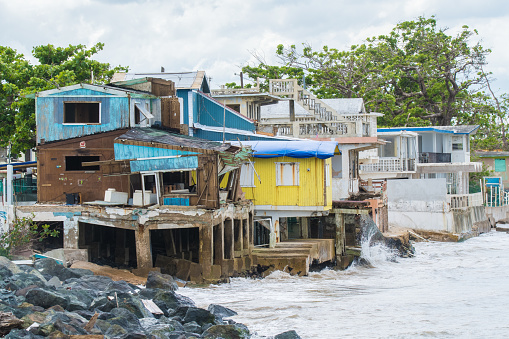 Seaside scene in Rincon, Puerto Rico after Hurricane Marie showing damage to businesses.