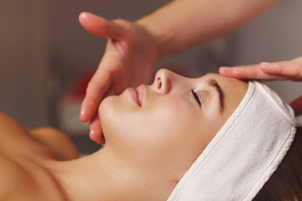 Spa treatment. Face massage stock photo