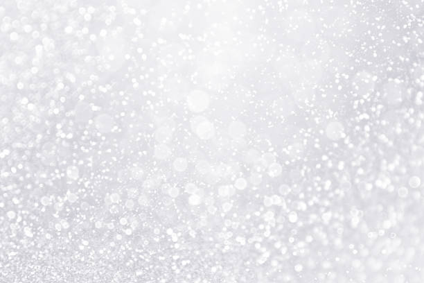istock Glitter Winter Snow Fall White Silver Background or Shiny Bling Sparks 872285396