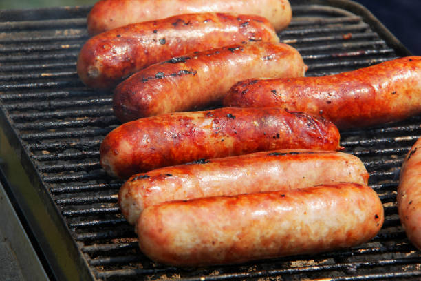 istock Bratwursts on a grill. 872288244