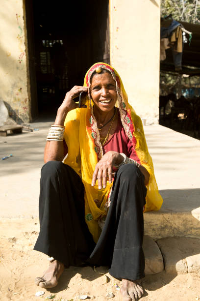 istock Indian woman talking on mobile phone 872300610
