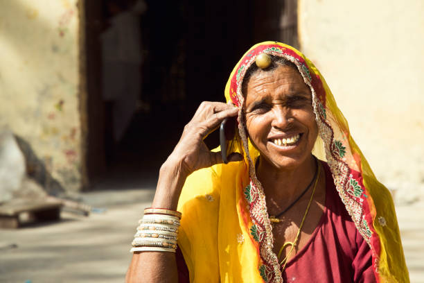 istock Indian woman talking on mobile phone 872300626