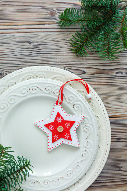 istock Porcelain plates with Christmas decor. 872305598