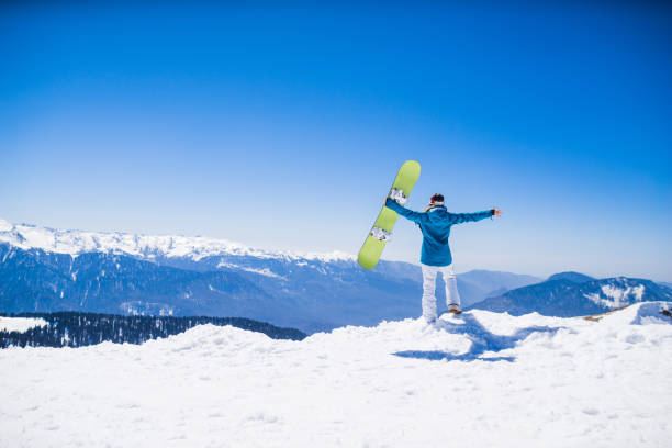 young  snowboarder woman young  snowboarder woman at ski resort snowboarding snowboard women snow stock pictures, royalty-free photos & images