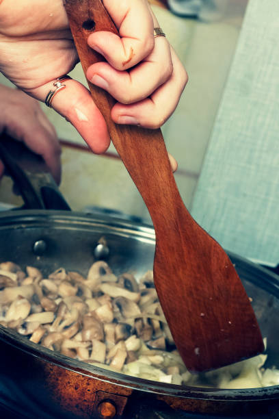 istock Woman prepares mushrooms 872316314