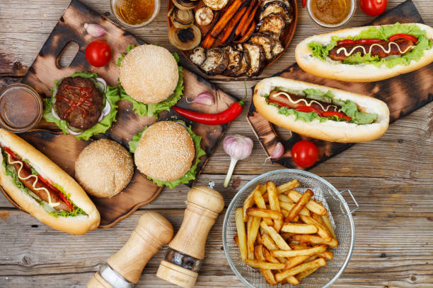 istock Various fast food on a wooden table. top veiw 872316510