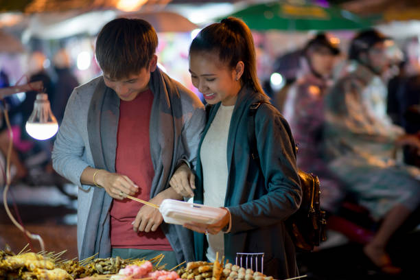 istock Travelers buying local dishes 872328052