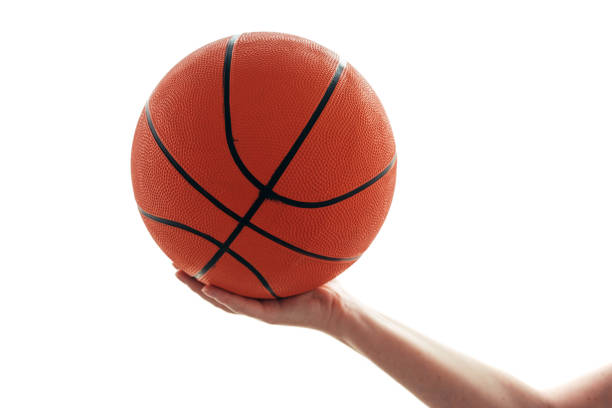 istock Female hand with basketball 872328092