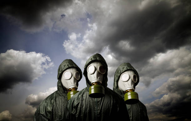 istock Gas masks and dramatic sky. Survival concept. 872330970