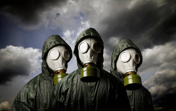istock Gas masks and dramatic sky. Survival concept. 872330978