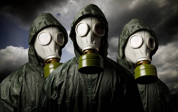 istock Gas masks and dramatic sky. Survival concept. 872330994