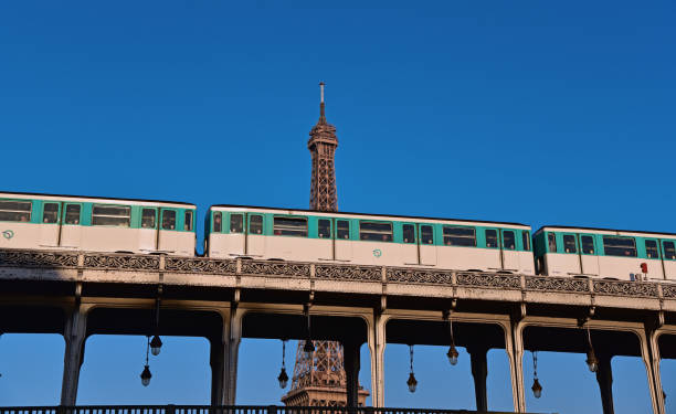 Paris, France - 11/07/2017 , late afternoon view of the tower and a metallic double level bridge used by cars and metro