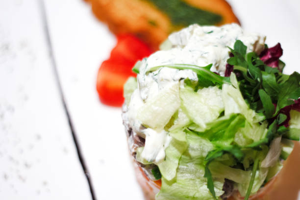 istock Chicken salad with leaf vegetables and cherry tomatoes . 872334790