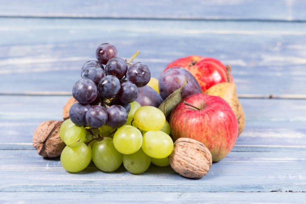 istock Autumn harvest concept on wooden background 872338920
