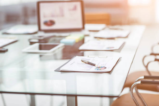 istock workplace with laptop and working documents for the business team in a modern office 872339422