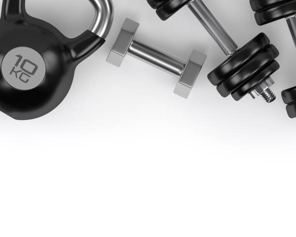 istock 3d rendering of dumbbells and kettlebell on white desk 872342466