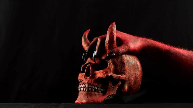 Red demon hand touching red demon skull. 50 fps