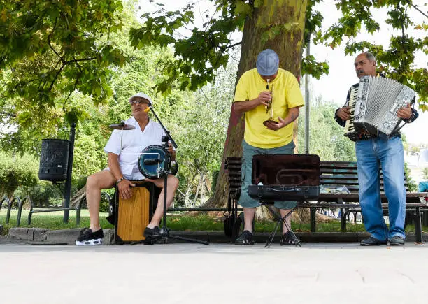 Bulgarian Street Musicians Playing Drums, Trumpet and Accordion in the Park