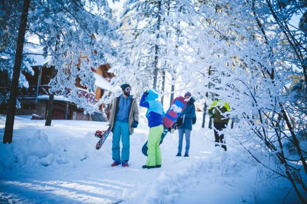 istock Snowboarders on way to the ski trace 872346758