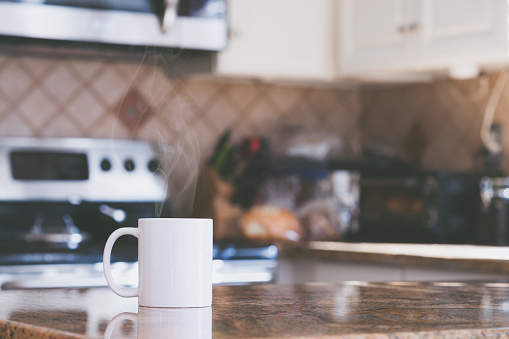 Modern kitchen interior and white hot coffee mug