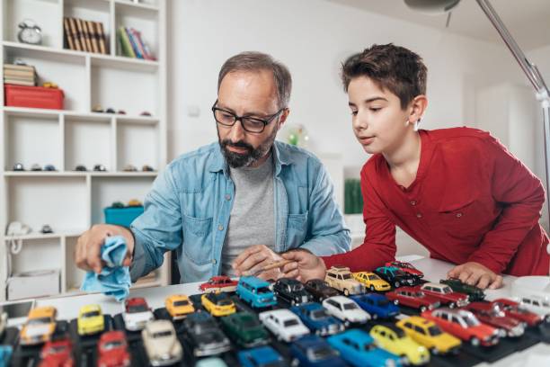 istock Father and son with his car collection 872352806